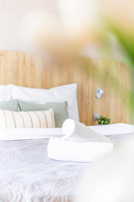 Postel nebo postele na pokoji v ubytování Hotel Sněžné