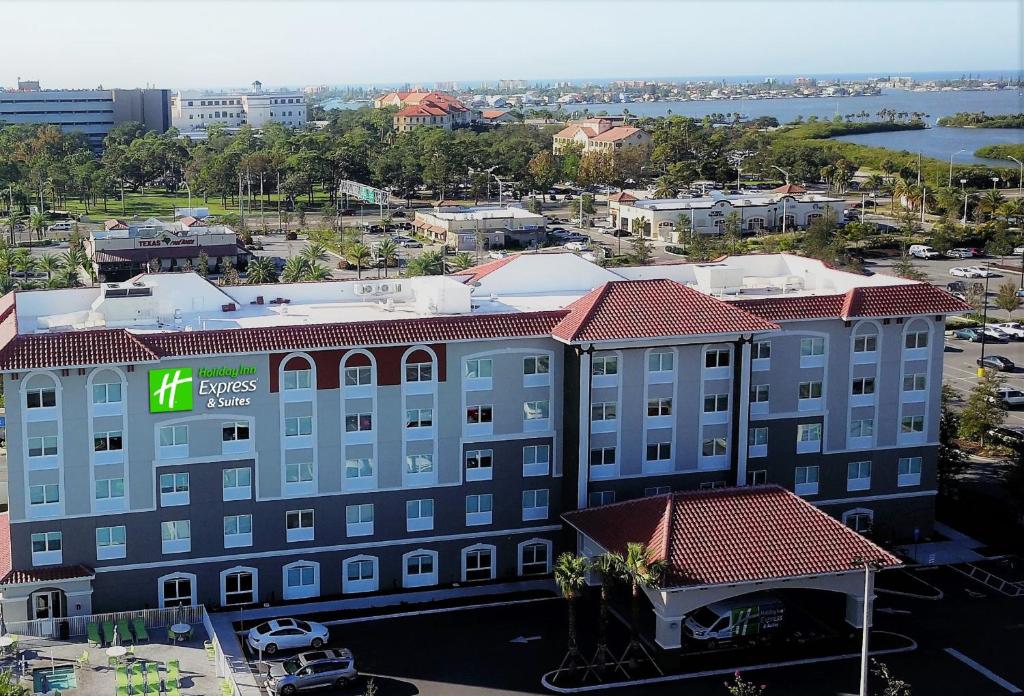 a building with a sign on the side of it at Holiday Inn Express & Suites - St. Petersburg - Madeira Beach, an IHG Hotel in St Petersburg