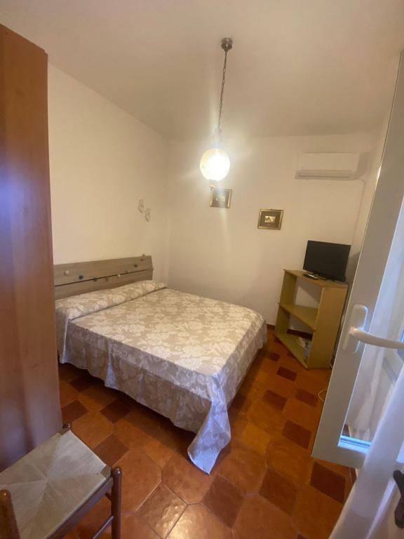Postel nebo postele na pokoji v ubytování A cas e Rosa