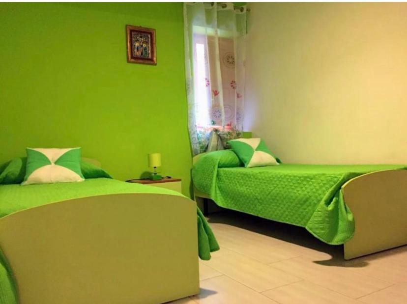 Łóżko lub łóżka w pokoju w obiekcie Appartamento Casa Trento