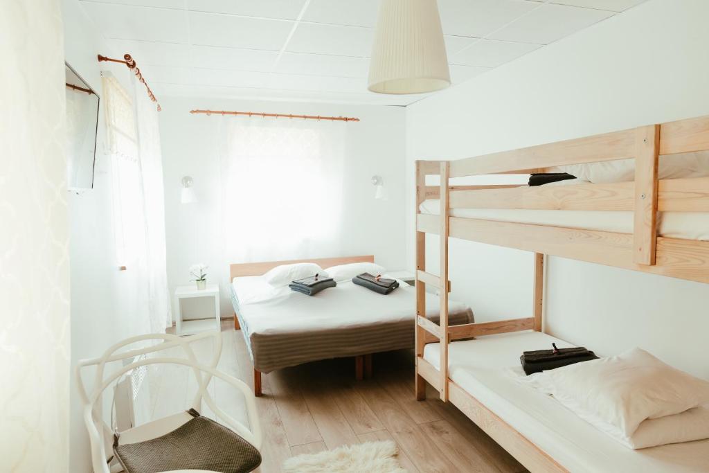 Postel nebo postele na pokoji v ubytování Konrad Family Guesthouse
