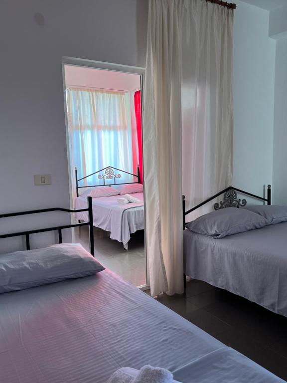Postel nebo postele na pokoji v ubytování Guest House L&B