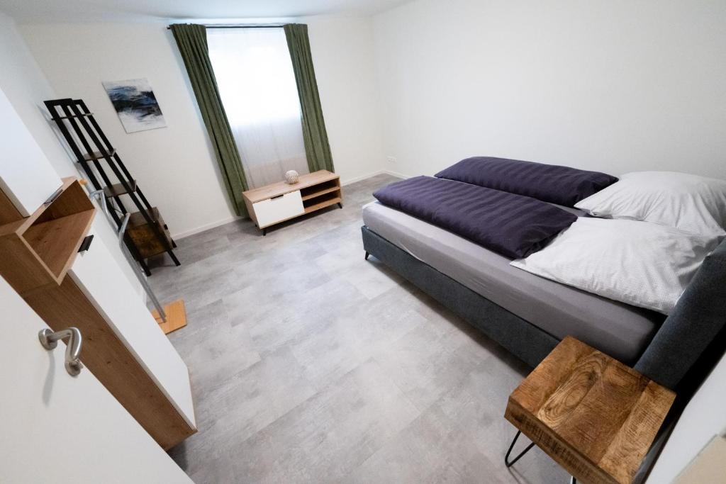 Postel nebo postele na pokoji v ubytování L&P Appartement Klagenfurt
