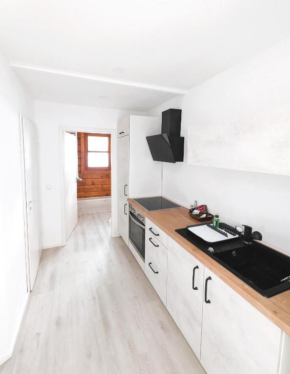 Kuchyň nebo kuchyňský kout v ubytování Apartment Nähe Airbus