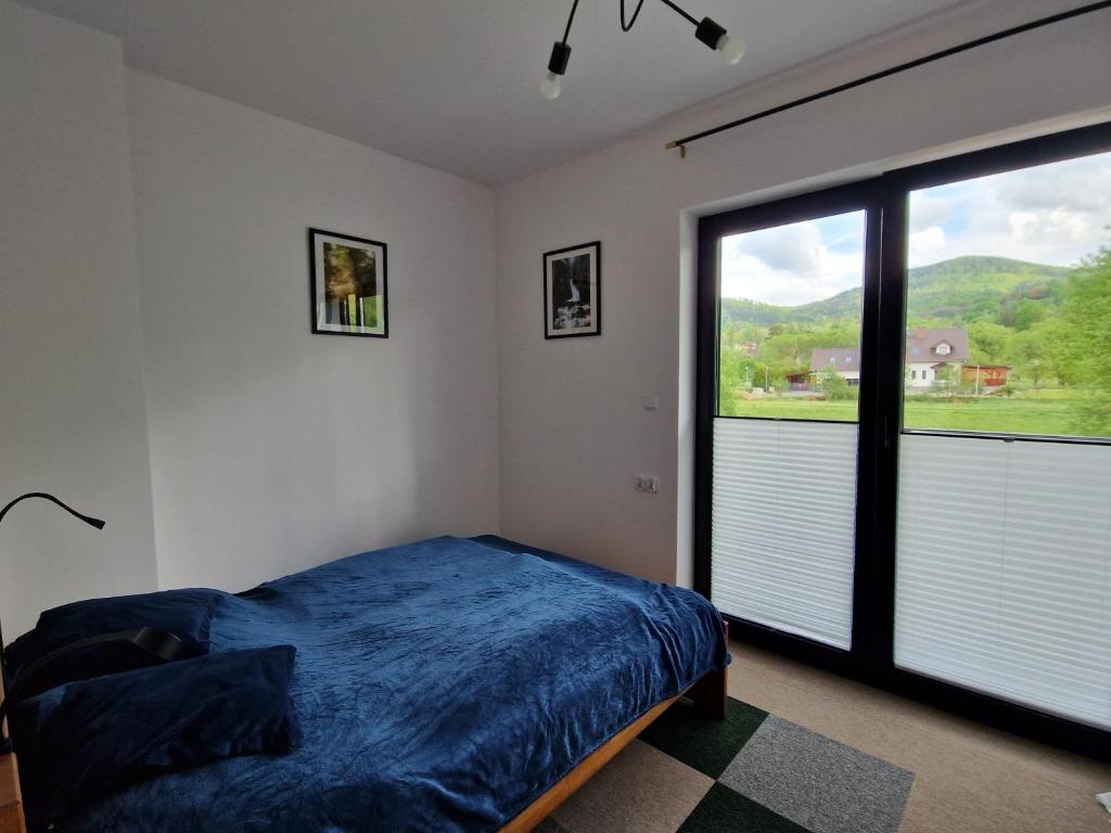 Postel nebo postele na pokoji v ubytování Apartament rodzinny Słoneczna Sosnówka
