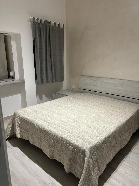 Postel nebo postele na pokoji v ubytování Bianca Appartamenti Bilocale