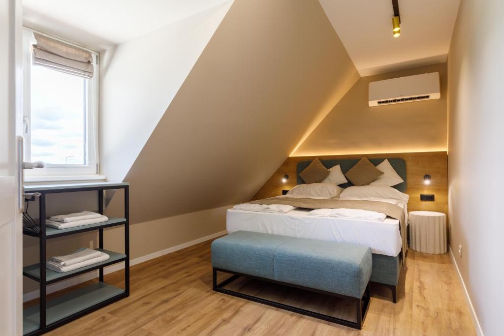 Postel nebo postele na pokoji v ubytování Lepke Apartmanház és Étterem
