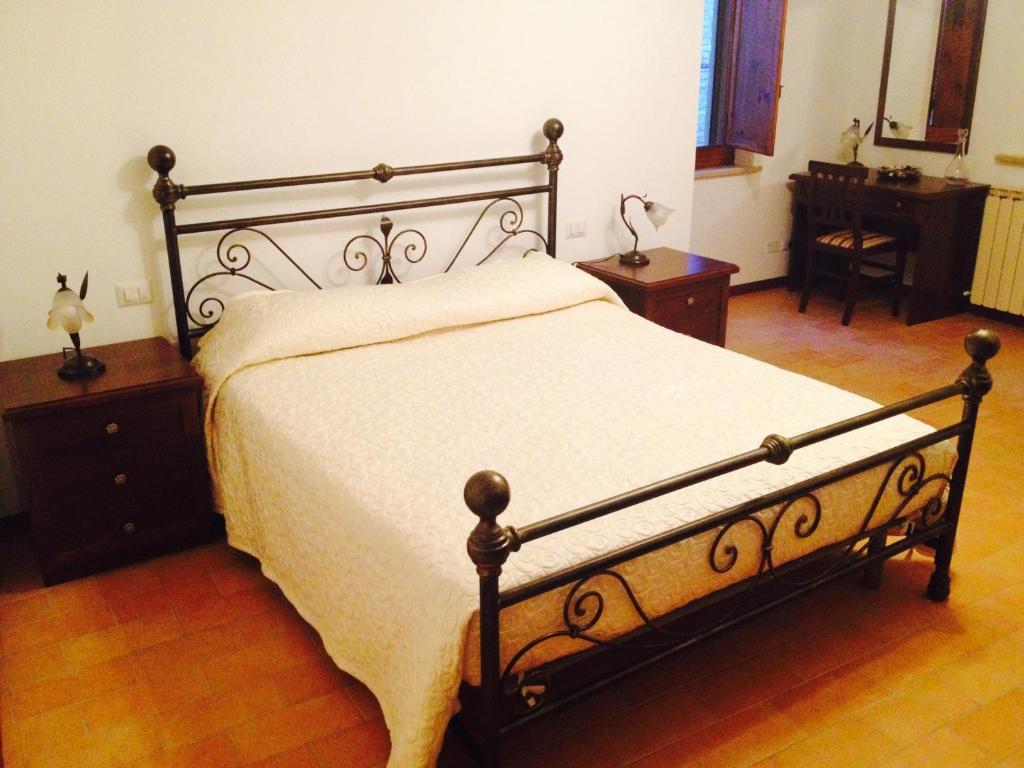 Postel nebo postele na pokoji v ubytování B&B La Dimora del Capitano