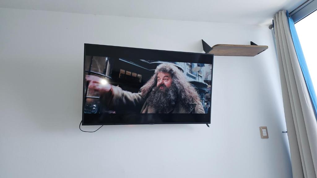 TV a/nebo společenská místnost v ubytování Cómodo Apartamento frente al Mar