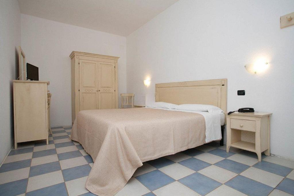 Postel nebo postele na pokoji v ubytování HOTEL SoleMare Gallipoli