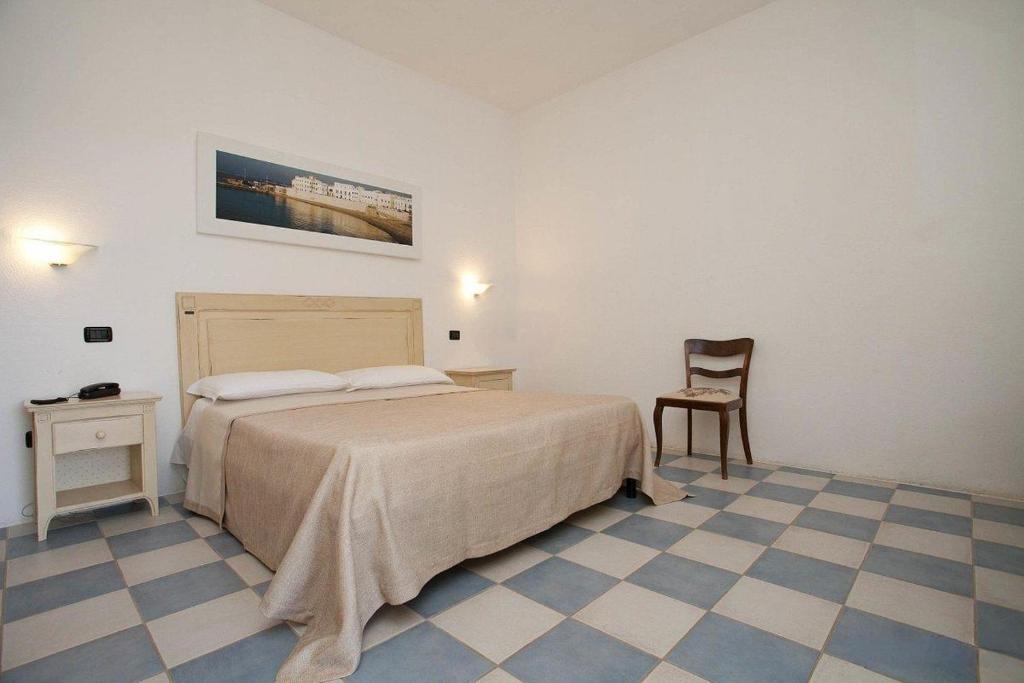 Postel nebo postele na pokoji v ubytování HOTEL SoleMare Gallipoli