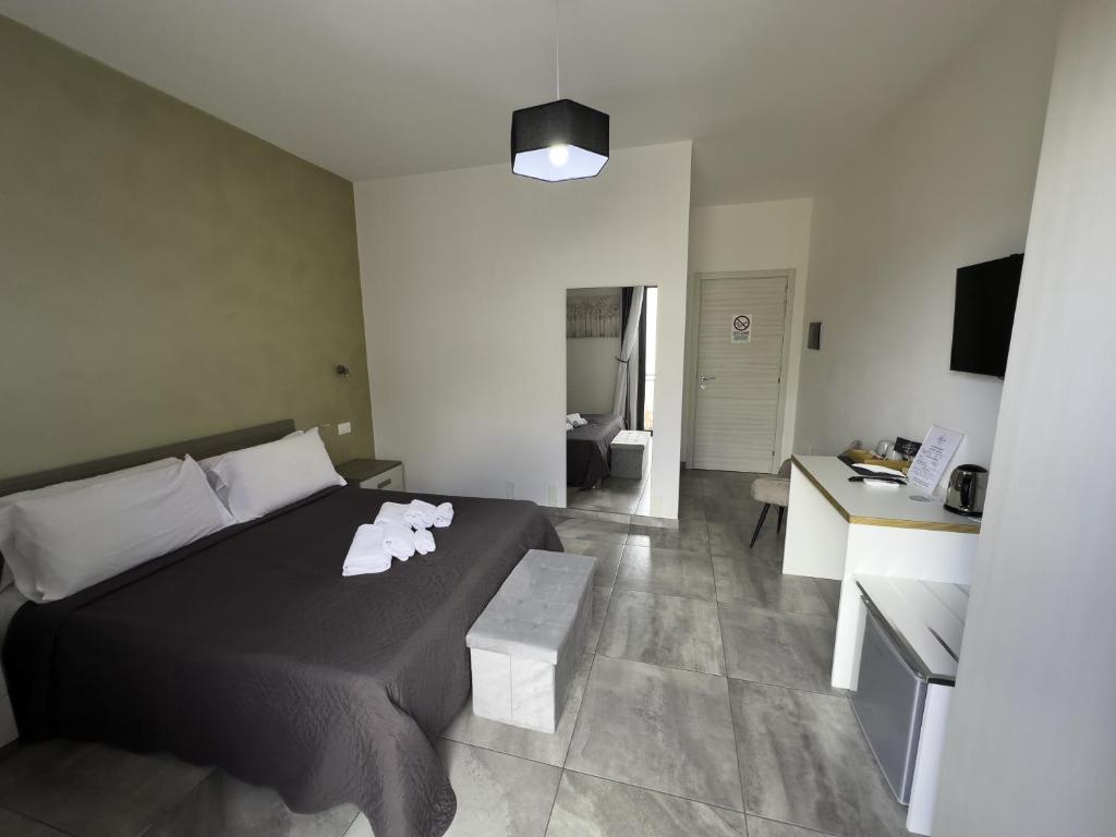 Łóżko lub łóżka w pokoju w obiekcie Four Winds B&B
