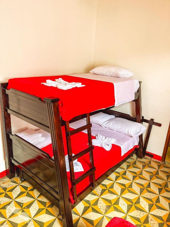 Postel nebo postele na pokoji v ubytování Hostal El Chili
