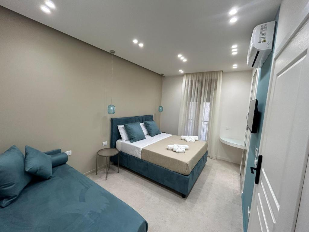 Un pat sau paturi într-o cameră la B&B Le Origini