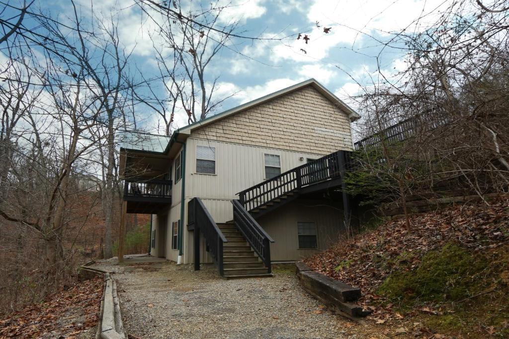 a house with a staircase on the side of it at Ivy Falls by Eden Crest in Pigeon Forge