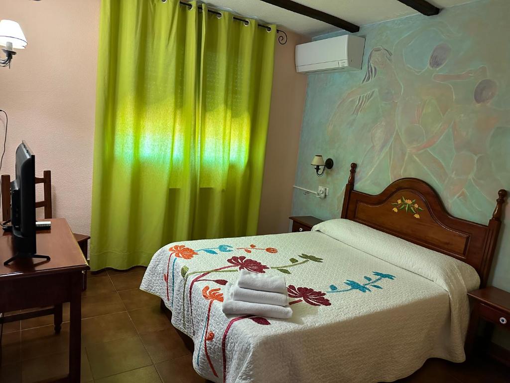 Postel nebo postele na pokoji v ubytování Hotel rural LA CASONA DE TAMAYA