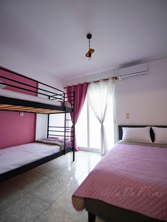 Postel nebo postele na pokoji v ubytování Villa De Flores