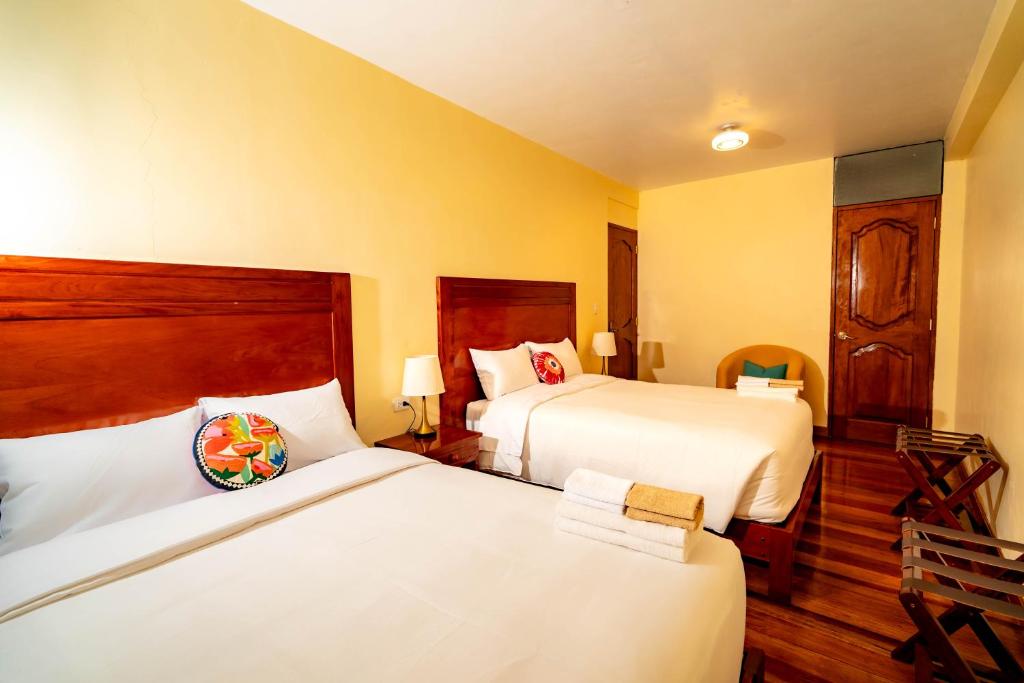 Postel nebo postele na pokoji v ubytování NUNA SUMAQ Hotel