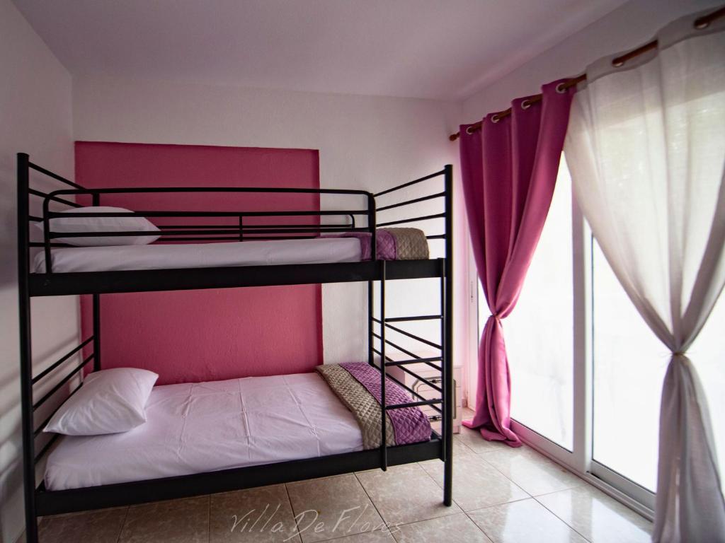 Postel nebo postele na pokoji v ubytování Villa De Flores