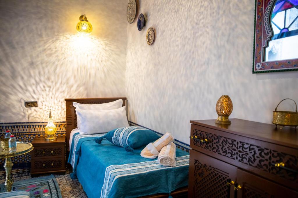 Postel nebo postele na pokoji v ubytování Riad Taj Fes