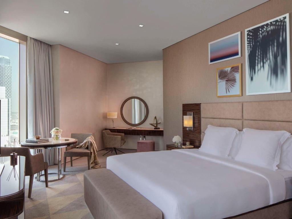 Postel nebo postele na pokoji v ubytování Hyde Hotel Dubai