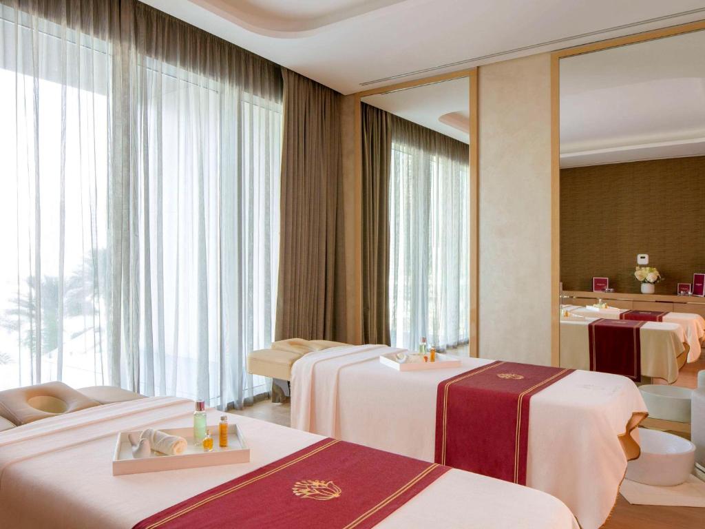Postel nebo postele na pokoji v ubytování Hyde Hotel Dubai