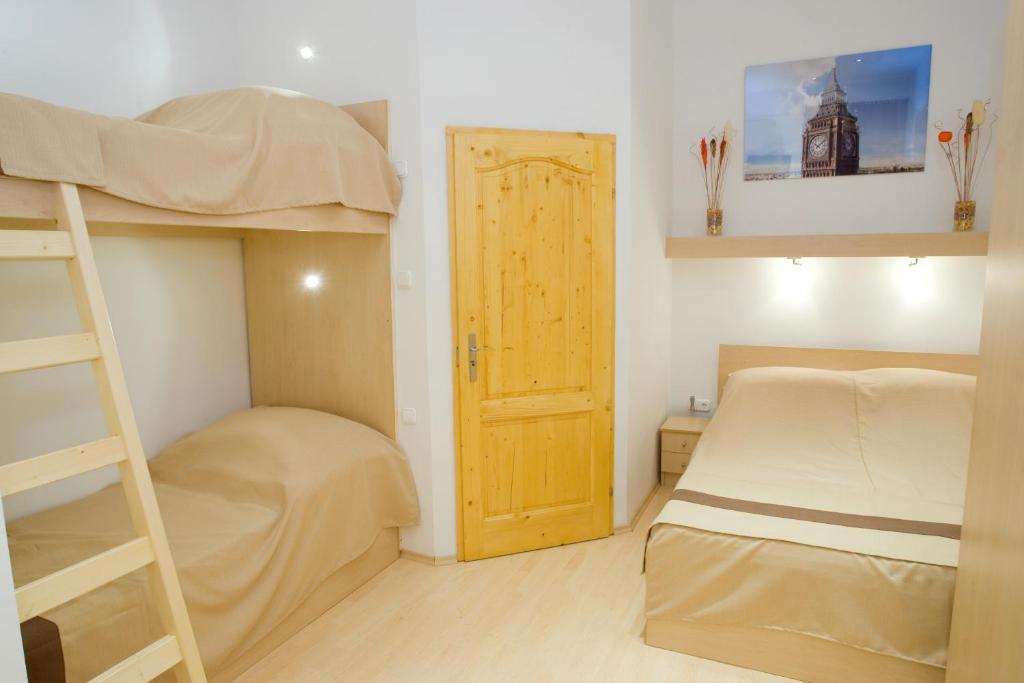 Posteľ alebo postele v izbe v ubytovaní Centrooms House
