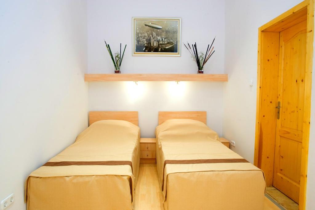 Posteľ alebo postele v izbe v ubytovaní Centrooms House