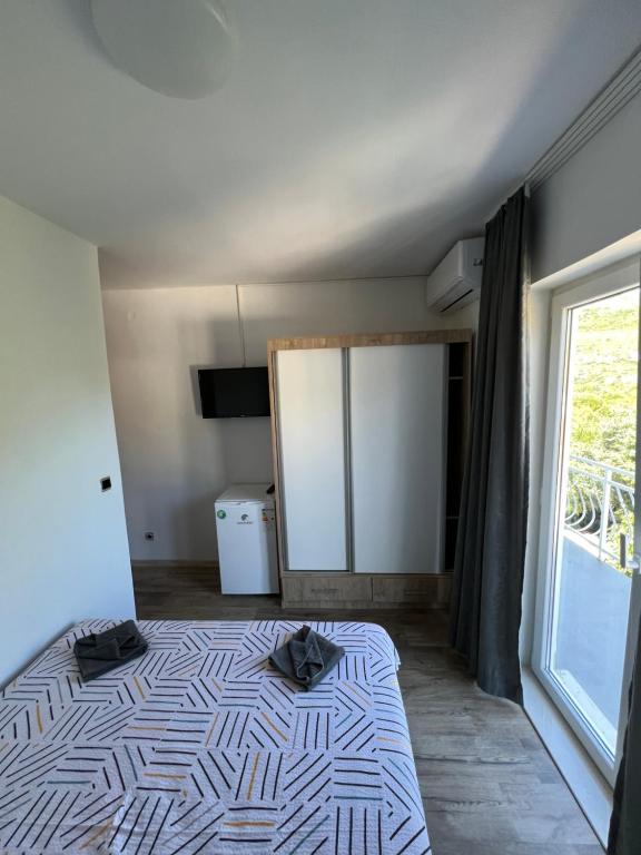 Postel nebo postele na pokoji v ubytování Apartmani Nika