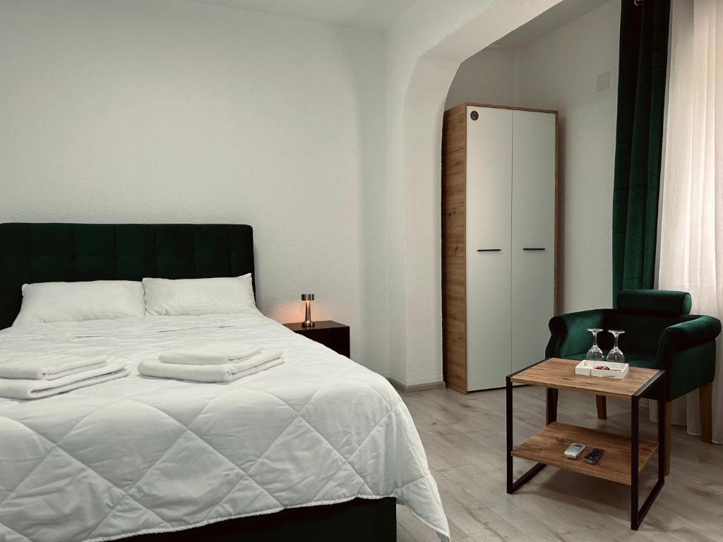 Postel nebo postele na pokoji v ubytování GreenHill Apartments
