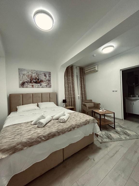 Postel nebo postele na pokoji v ubytování GreenHill Apartments