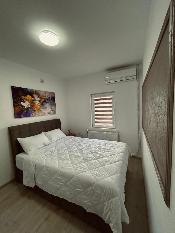 Postel nebo postele na pokoji v ubytování GreenHill Apartments