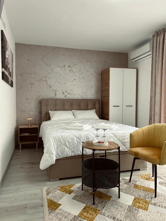 Postel nebo postele na pokoji v ubytování GreenHill Apartments