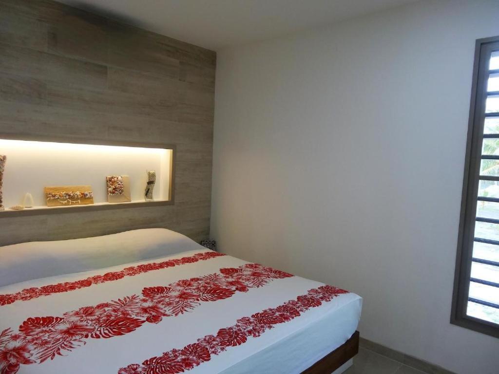 Letto o letti in una camera di Pension Tiputa Lodge Rangiroa
