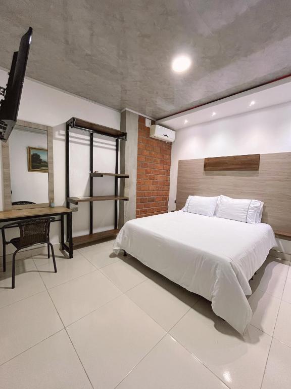 Postel nebo postele na pokoji v ubytování HOTEL LIGHT PLAZA