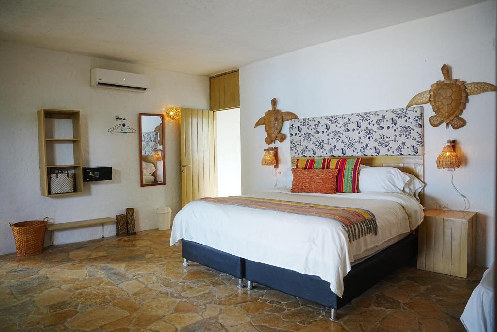 Postel nebo postele na pokoji v ubytování Hotel Isla Real
