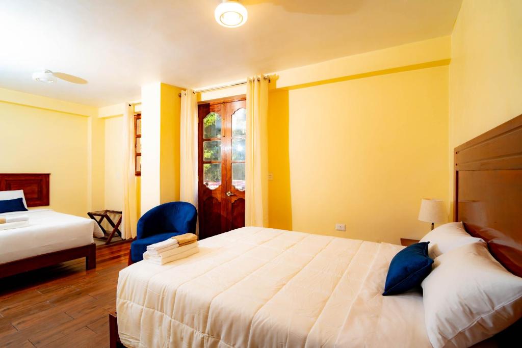 Postel nebo postele na pokoji v ubytování NUNA SUMAQ Hotel