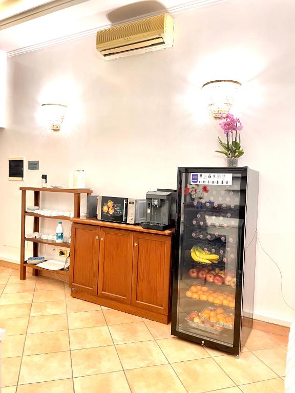 Kuchyň nebo kuchyňský kout v ubytování Hotel Rome place