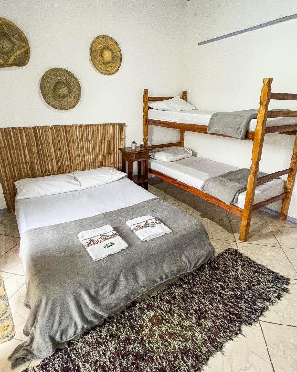 Postel nebo postele na pokoji v ubytování Hostel Embaúba Paraty