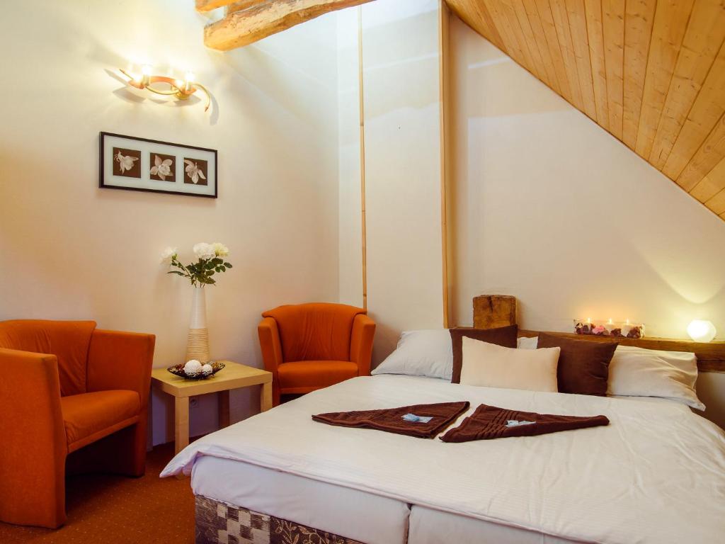 Postel nebo postele na pokoji v ubytování Hotel BELLA