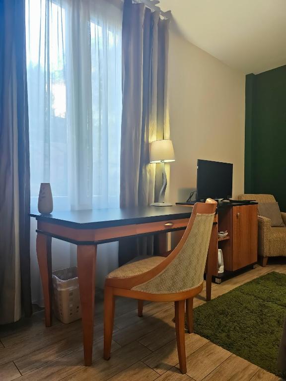 TV a/nebo společenská místnost v ubytování Male stepenice