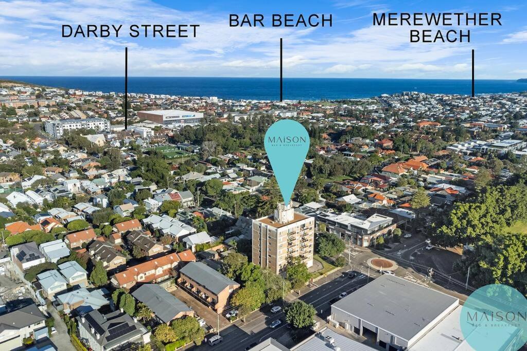 an aerial view of the city of melbourne with a blue arrow pointing to at Central Cooks Hill Apartment in Wickham