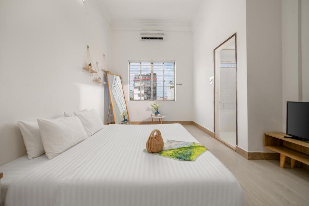 Postel nebo postele na pokoji v ubytování KLy Apartment Hotel