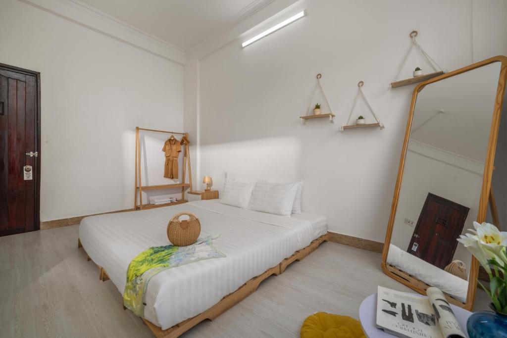Postel nebo postele na pokoji v ubytování KLy Apartment Hotel