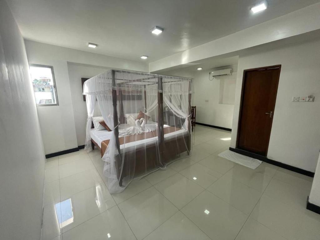 Postel nebo postele na pokoji v ubytování Rush City Hotel Kandy