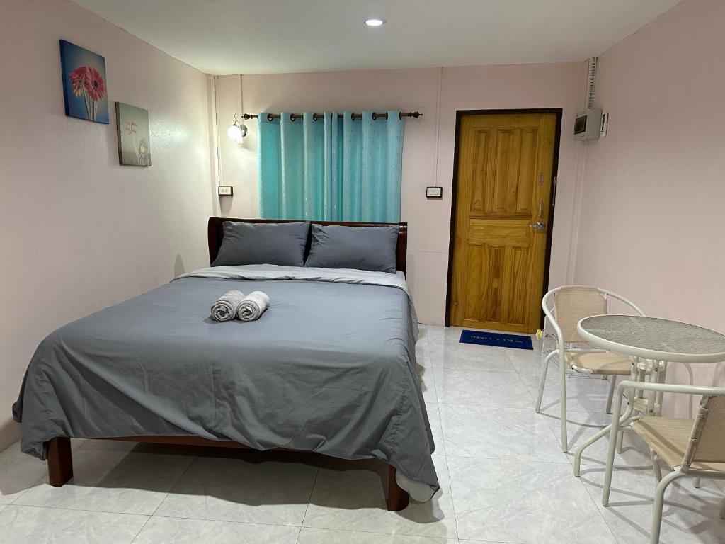 Postel nebo postele na pokoji v ubytování Smile Resort