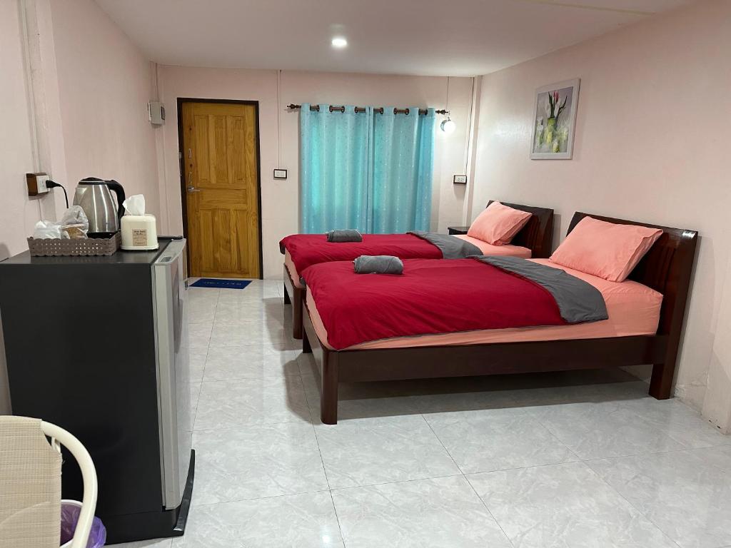 Postel nebo postele na pokoji v ubytování Smile Resort