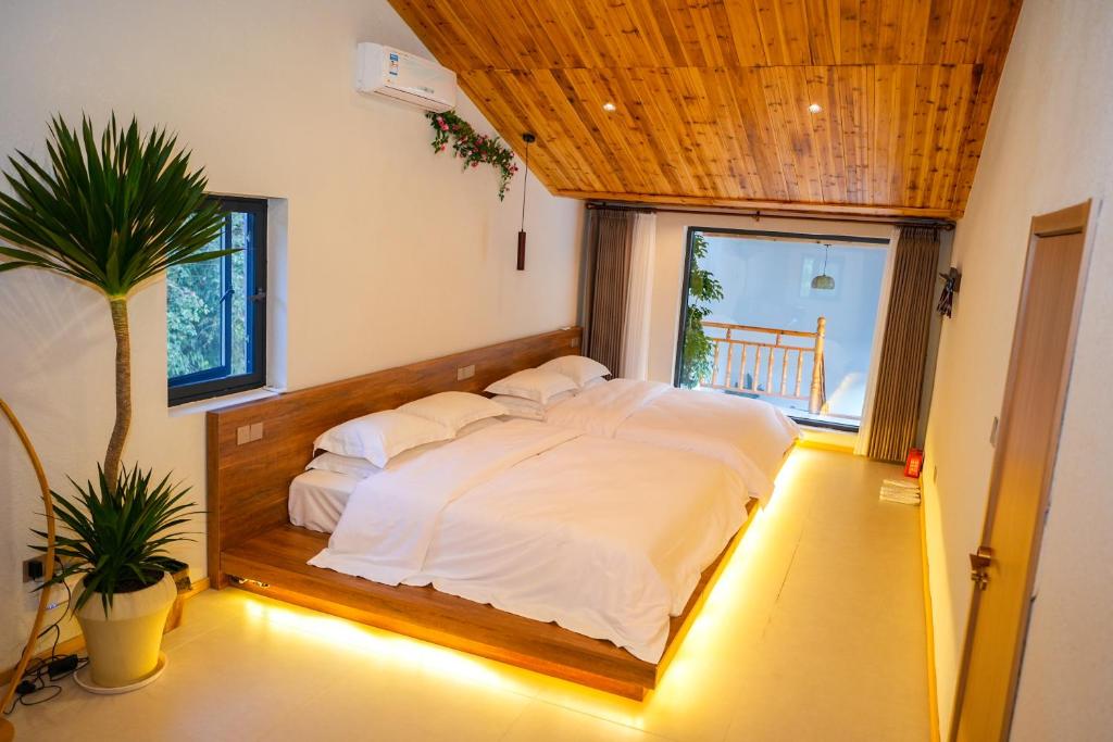 Postel nebo postele na pokoji v ubytování 楊家小院