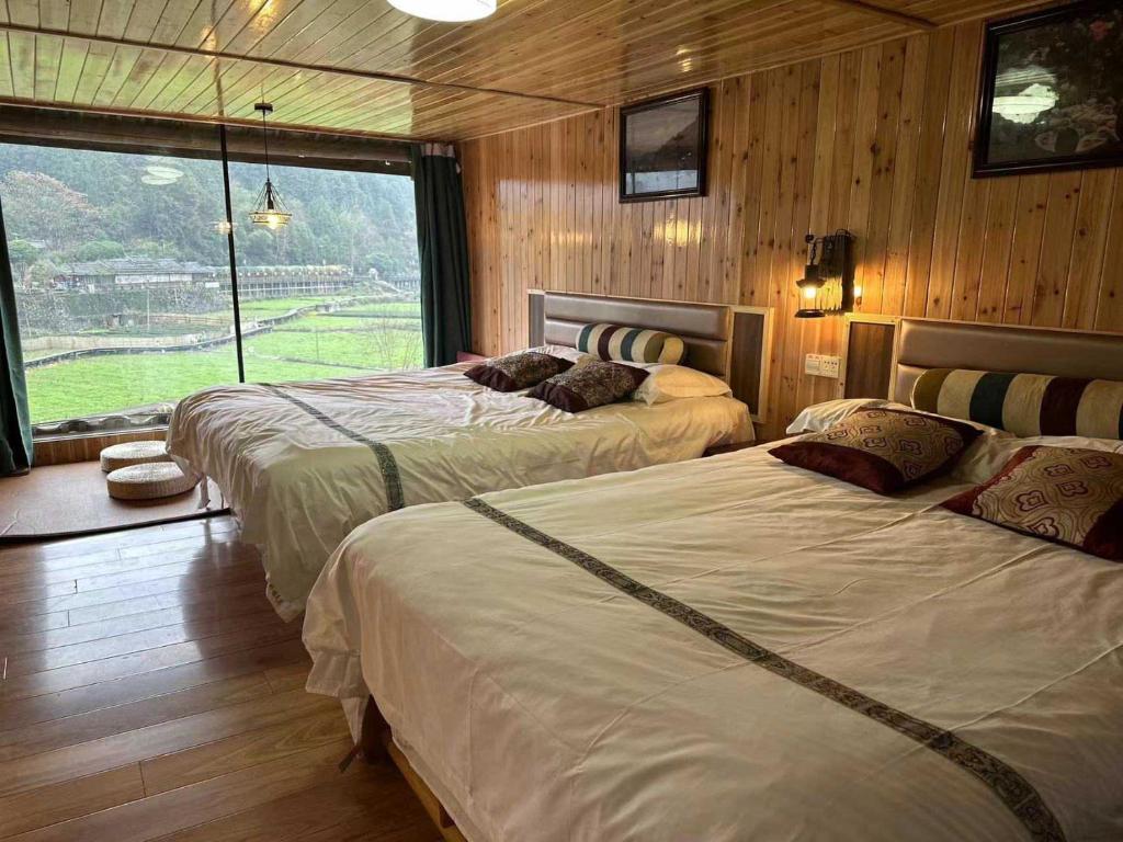 Postel nebo postele na pokoji v ubytování Bridge View Boutique Guesthouse 望桥楼精品民宿