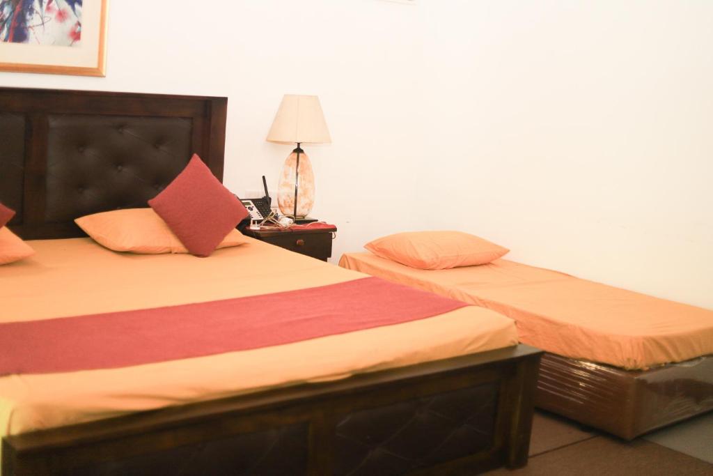 Postel nebo postele na pokoji v ubytování Hotel Ro Kalawewa